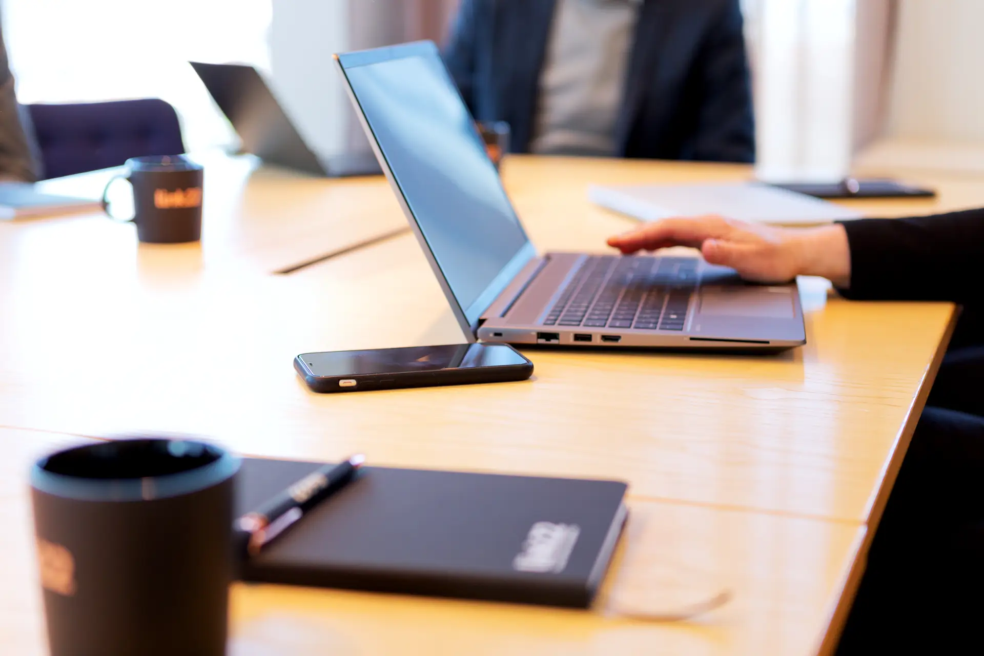 phone next to laptop that can be bugged